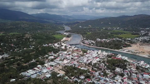 Drone view of a picturesque and quiet fishing village in the mountain Stock Footage 150580902