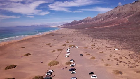 Drone view of Playa de Cofete beach and volcanic mountains in Fuerteventura Stock Footage 310358092