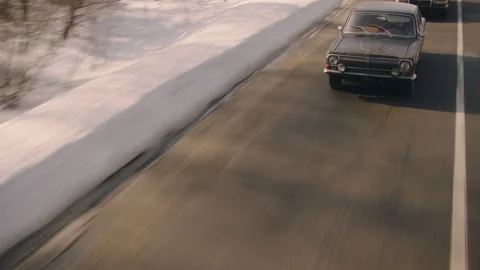 Drone view of Police Car chasing a person in another car and getting really Stock Footage 283108839