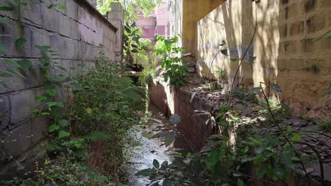 A drone view of polluted Bengaluru residential drainage canals reveals foul.. Stock Footage 340500075
