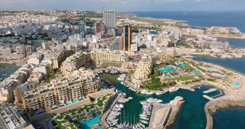 Drone view of Portomaso tower in St. Julians city, Malta. Sigma forum Stock Footage 221550398