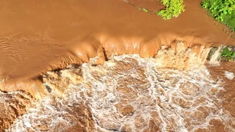 Drone view of powerful muddy flood. Video stock 342100552