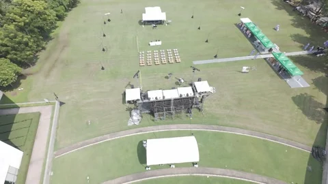 Drone View of Public Concert on Grass Field With Stage and Spectators Stock Footage 308700514