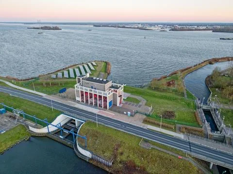 Drone view pumping station complex with solar panels by water Stock Photos