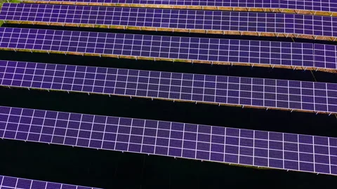 Drone view of purple tinted solar panel rows, Bulgaria Stockbeeldmateriaal 341756972