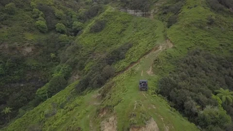 Drone View Of Quad Driving Uphill Stock Footage