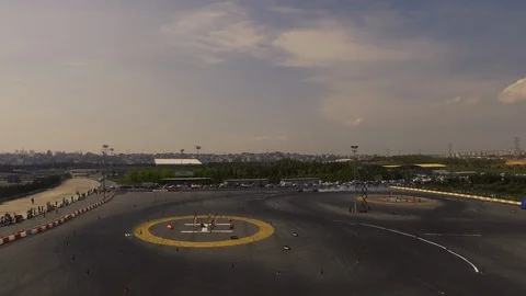 Drone view of a race car drift pist, drift championship ,race cars Stock Footage 129066196