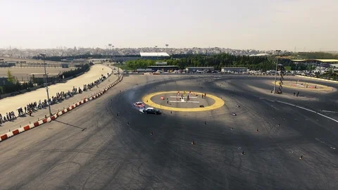 Drone view of a race car drift pist, drift championship ,race cars Stock Footage 129066653