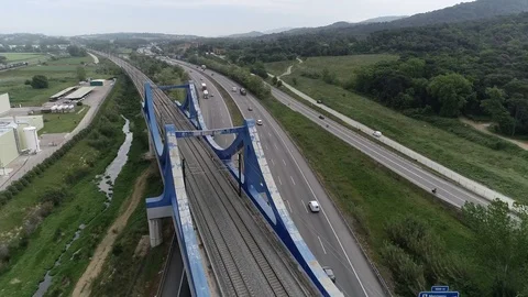 Drone view of railway bridge over a highway Stock Footage 111088829