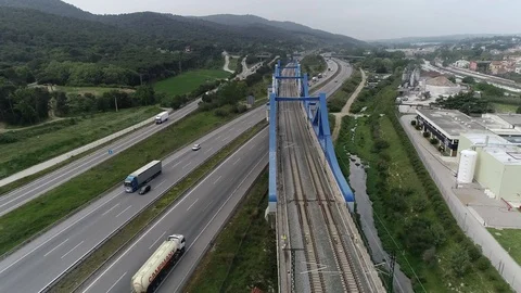 Drone view of railway bridge over a highway Stock Footage 111089206