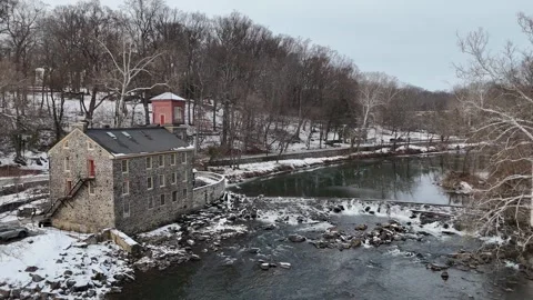 Drone view of the rapids on Brandywine River after snow in Wilmington, Delaware Video stock 326989999