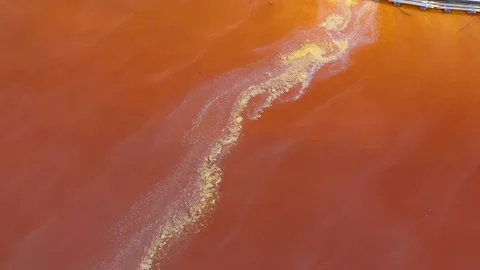Drone view of red polluted mine water from copper open pit excavation Stock Footage 109221376