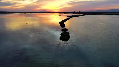 Drone view of red sunset in las Salinas lagoons. Stock Footage 288608537