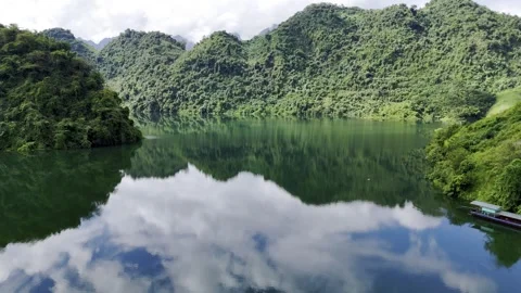 Drone view of reflective Black Lake in northern Vietnam – 4K Video stock 325036181