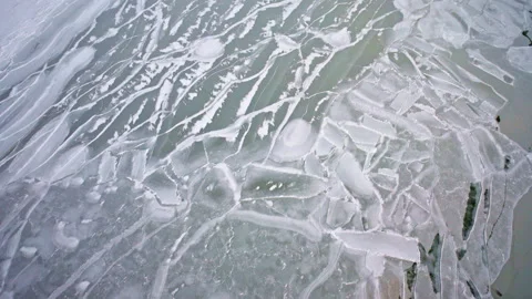 Drone view of remarkable frozen ice formations spread across the surface of Stock Footage 340255369