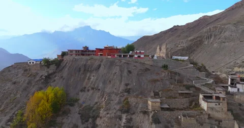 Drone view of remote cliffside monastery and mountain valley in Annapurna Video stock 342684048