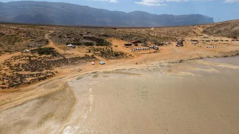 Drone view of remote desert beach with lagoon and campsite. Detwah Lagoon, .. Stock-Fotos