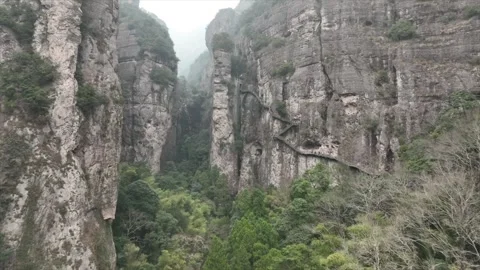 Drone view revealing impressive height and deep canyon formations of steep Stock Footage 340106055