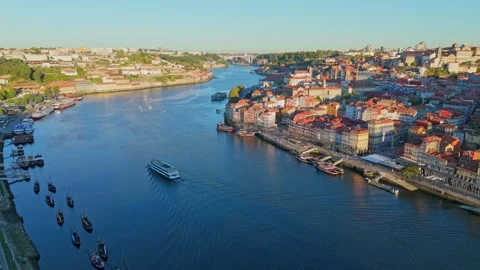 Drone view of Ribeira and Douro River, Portugal, sunrise drone boat view Stock Footage 344348004