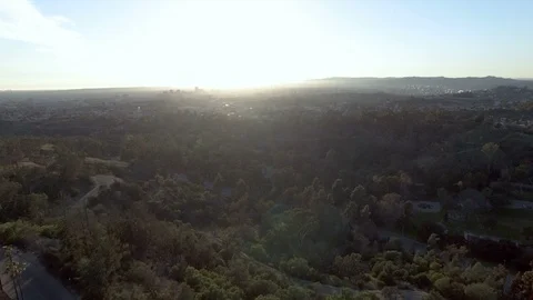 Drone view rising above Echo Park in Los Angeles at sunset 스톡 동영상 86547733
