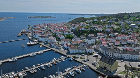 Drone view of Risor Norway harbour with boats and traditional wooden houses. Stock Footage 328125904