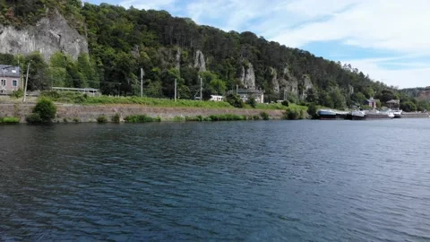 Drone view of river and train in background, Freight train with cargo carriages Stock Footage 138869031