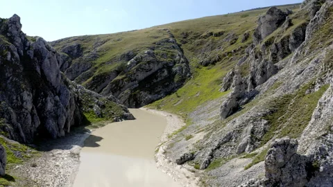 Drone view of a river in the mountains of abruzzo Italy on a sunny day Video stock 264001615