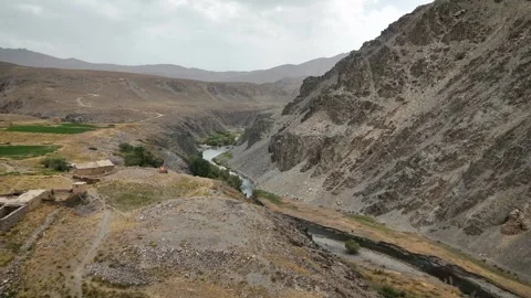 Drone View of River Valley and Rocky Mountains in Afghanistan Stock Footage 317940406