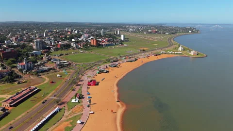 Drone view of riverside beach area with promenade and park space beside the Vídeos de archivo 314360221