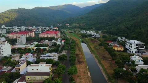 Drone View of Riverside Homes and Mountains in Da Nang, Vietnam Vídeo Stock 340487465