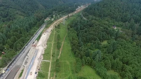 Drone view of a road between forest Stock Footage 108690529