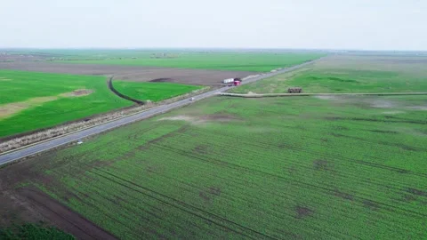 Drone view of a road between green fields Video stock 272994100