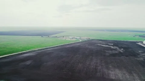 Drone view of a road between green fields Video stock 272994105