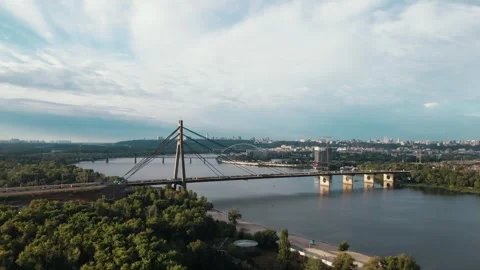 Drone view of road bridge, North bridge over Dnipro river. Sunset in Obolon Stock Footage 245003965