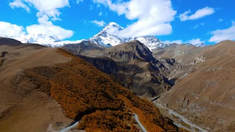 Drone view of road leading to famous scenery Mount Kazbegi Stock Footage 224908925