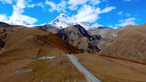 Drone view of road leading to Mount Kazbegi Stock Footage 224907509