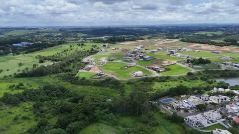 Drone View of Rolling Farmland Beneath Dramatic Clouds Stock Footage 325810830