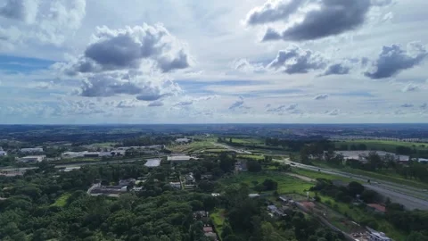 Drone View of Rolling Green Fields and Scattered Farmhouses Stock Footage 325810024