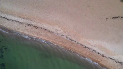 Drone view rotates down on the seashore and falls 動画素材 209130161