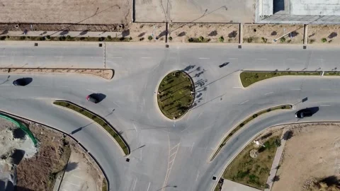 Drone view of roundabout where traffic is flowing from different side Stock Footage 302731488