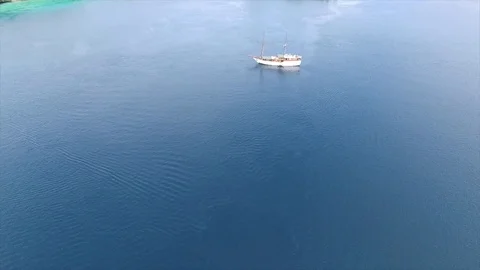 Drone view a sailing ship on the coast of West Papua Stock Footage 126264647