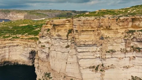 Drone view of Sanap Cliffs, Gozo island. Rocks and cliffs, sea Stock Footage 329989996