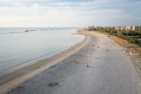 Drone view of sandy beach and town background Photos