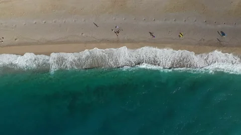 Drone view of sandy beach with turquoise sea waves 스톡 동영상 233069105