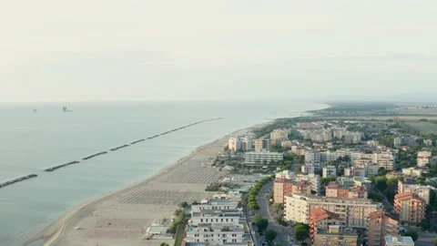 Drone view of sandy beach with umbrellas and gazebos Stock Footage 158699845