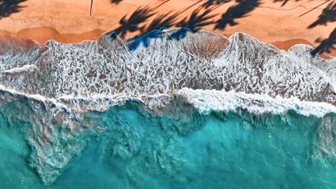 Drone view of a sandy beach with waves in the background. Stock Footage 318979580