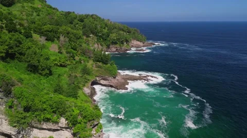 Drone view Sawangan beach with cliffs and trees Stock Footage 293896469