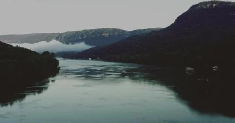 Drone view of a Scenic Lake Between Majestic Mountains Stock Photos
