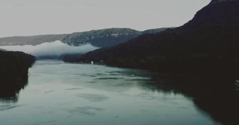 Drone view of a Scenic Lake Between Majestic Mountains Stock Photos