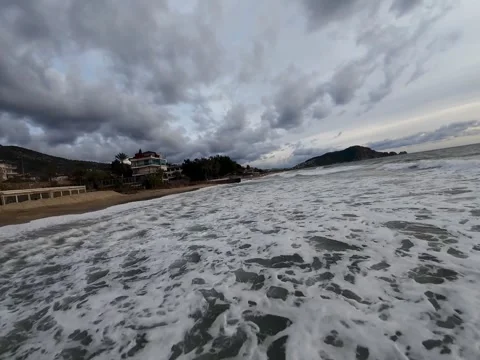 Drone view of sea waves and foam rock sandy beach Stock Footage 302582520